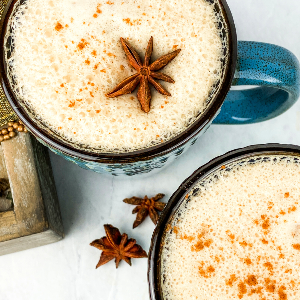 chai latte with star anise in mug