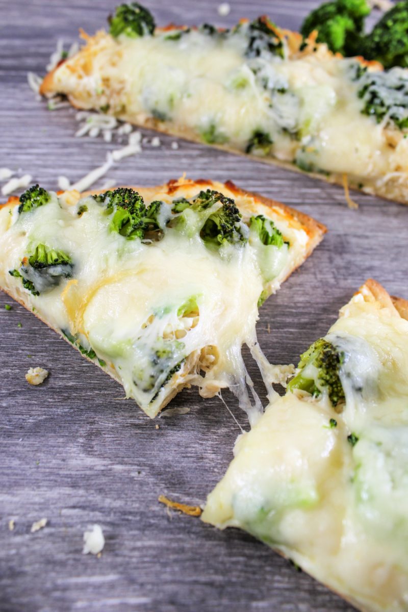 close up of chicken and broccoli flatbread pizza