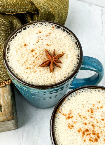 delicious creamy homemade vanilla chai latte in blue mugs