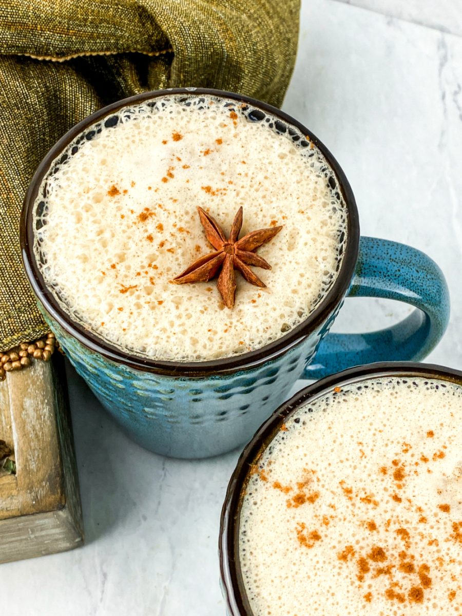 delicious creamy homemade vanilla chai latte in blue mugs