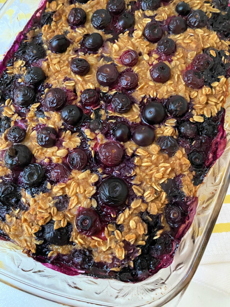 glass dish with breakfast oatmeal with blueberries