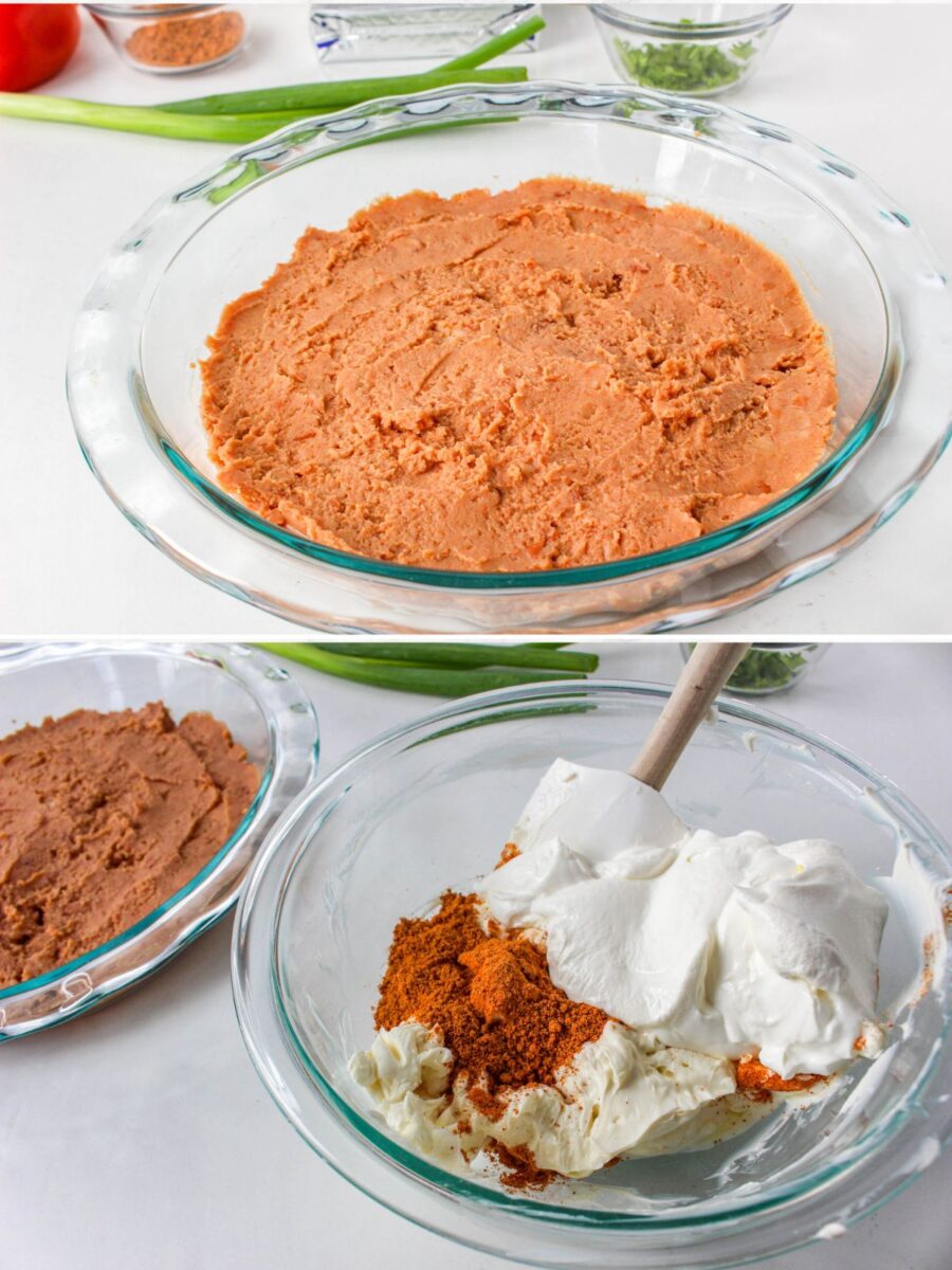 Cream cheese, sour cream, and taco seasoning being mixed together while the refried bean layer waits in the baking dish.