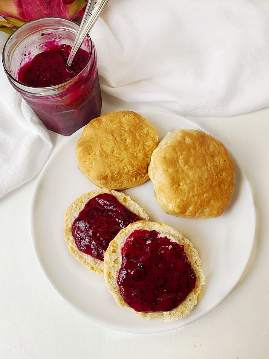 biscuits with dragon fruit jam on them with jar in background
