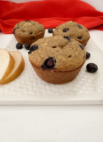 blueberry pear muffins with allspice on white platter ready to enjoy