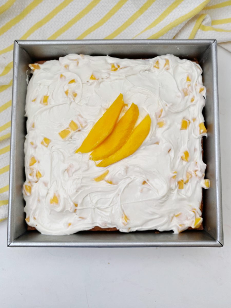 cake with mango and coconut and a mango lemon frosting