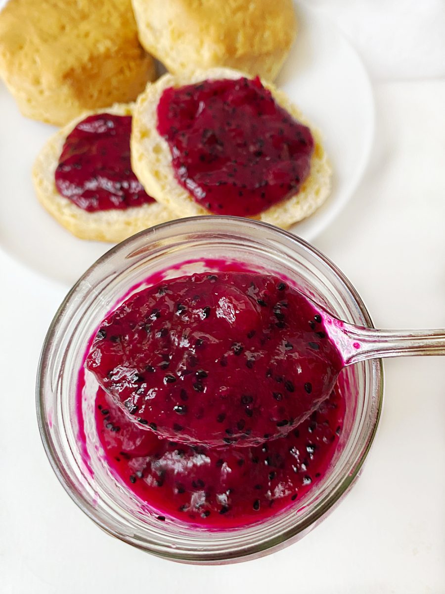 close up dragon fruit jam in mason jar with spoon
