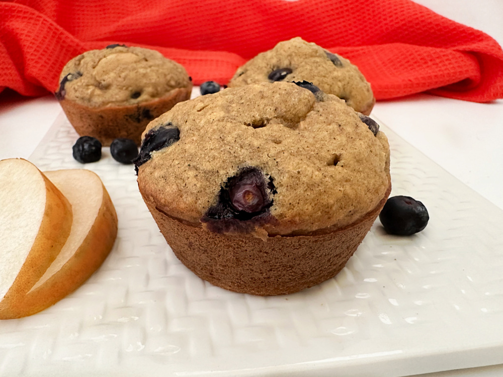 delicious homemade blueberry pear muffins on serving plate