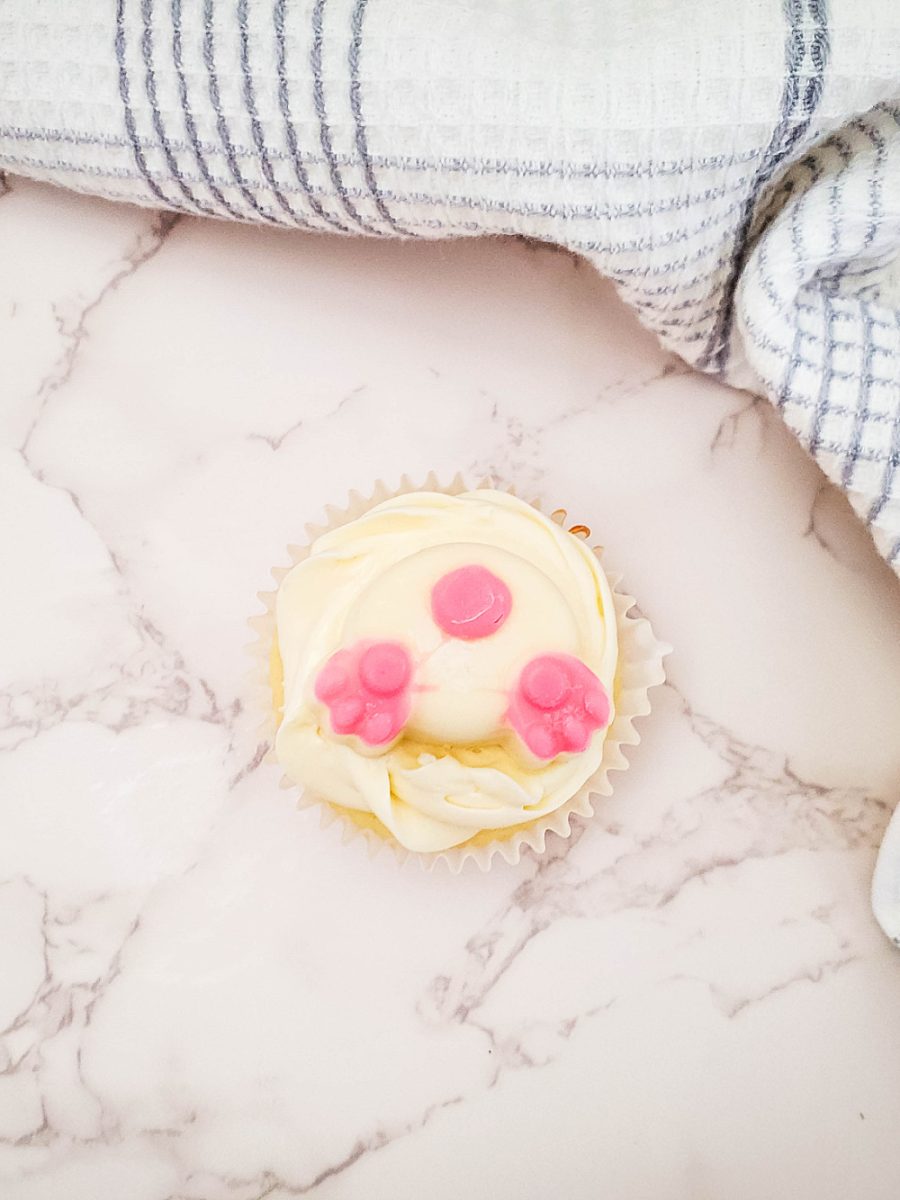 frost cupcake and add the white chocolate bunny butt on top