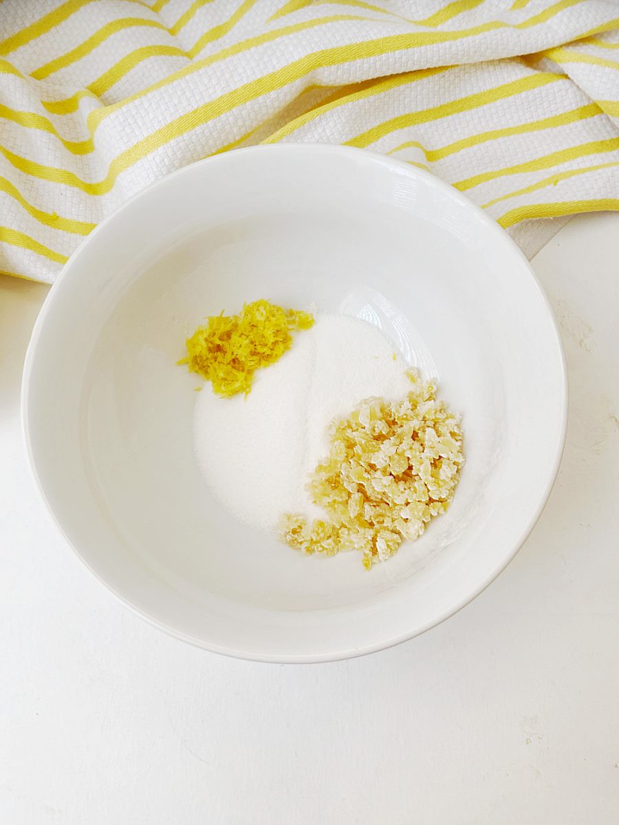 mixing the lemon zest with the sugar and candied ginger in small bowl