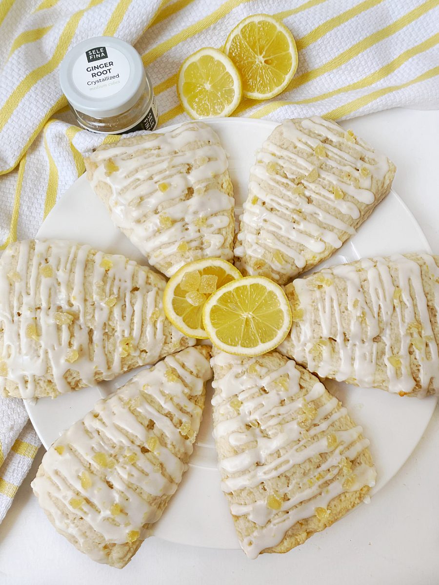 overhead view of lemon ginger scones with slices of lemon