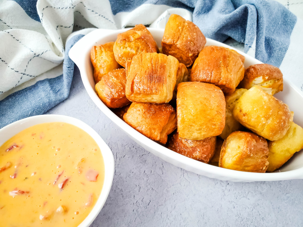 delicious snack of spicy cheese dip and pretzel bites