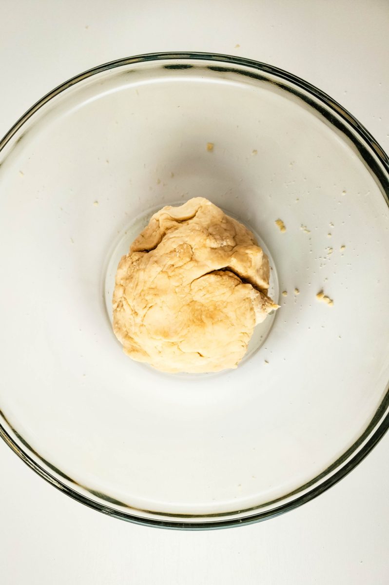 pretzel dough in bowl ready to rise