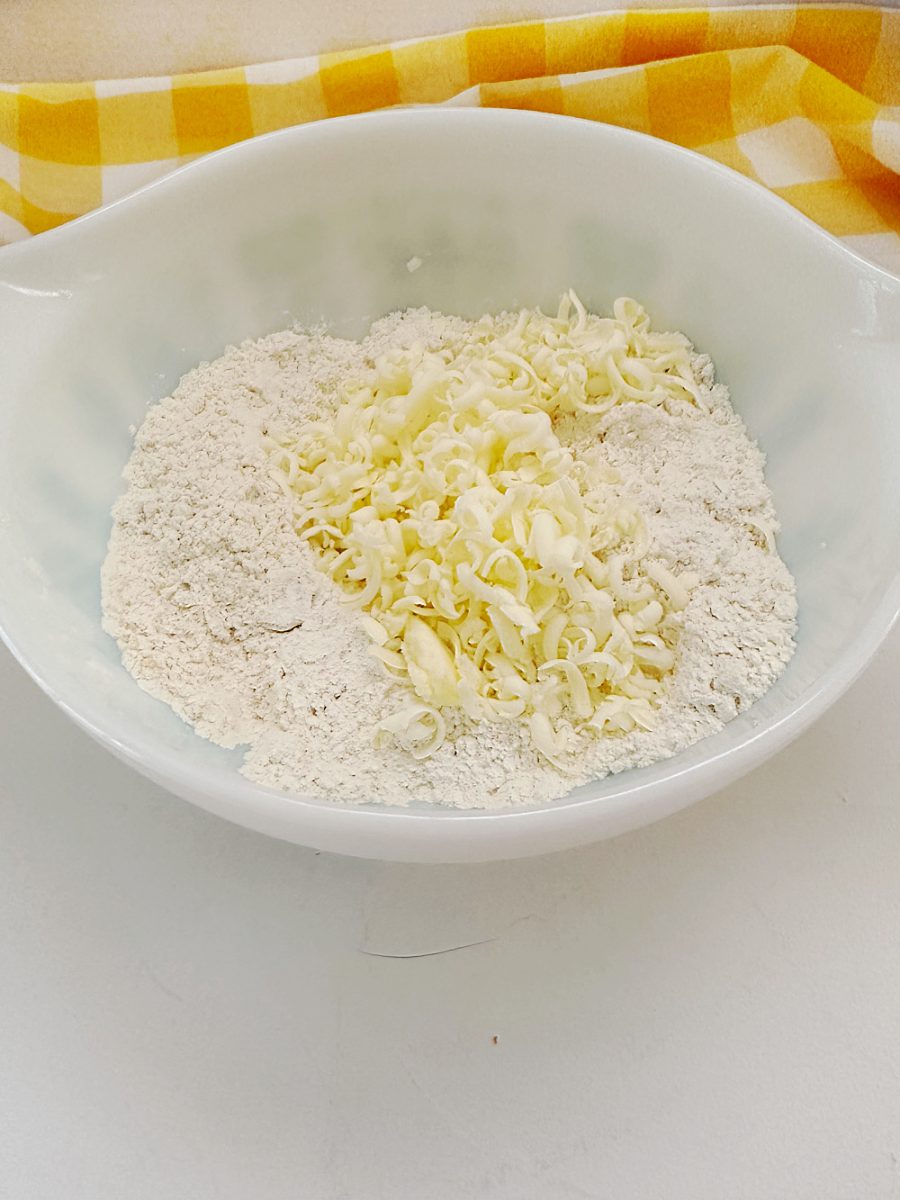 adding the grated butter to the dry ingredients for scones