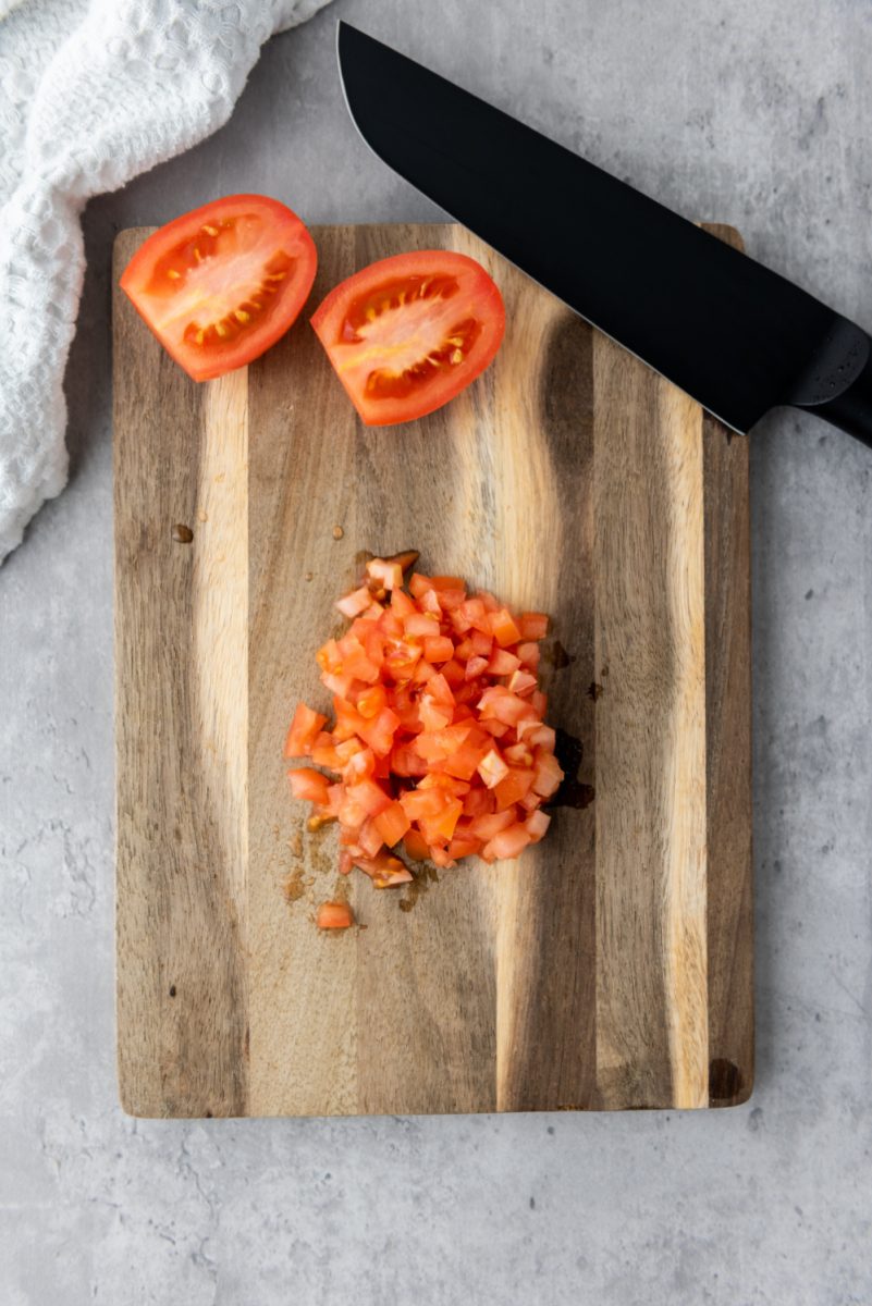 diced roma tomatoes on cutting board