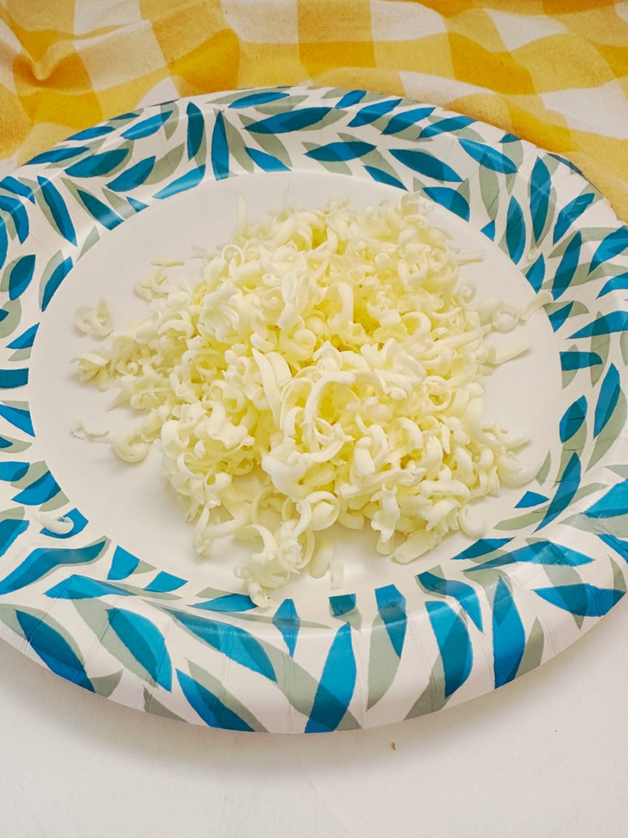 grated frozen butter on paper plate