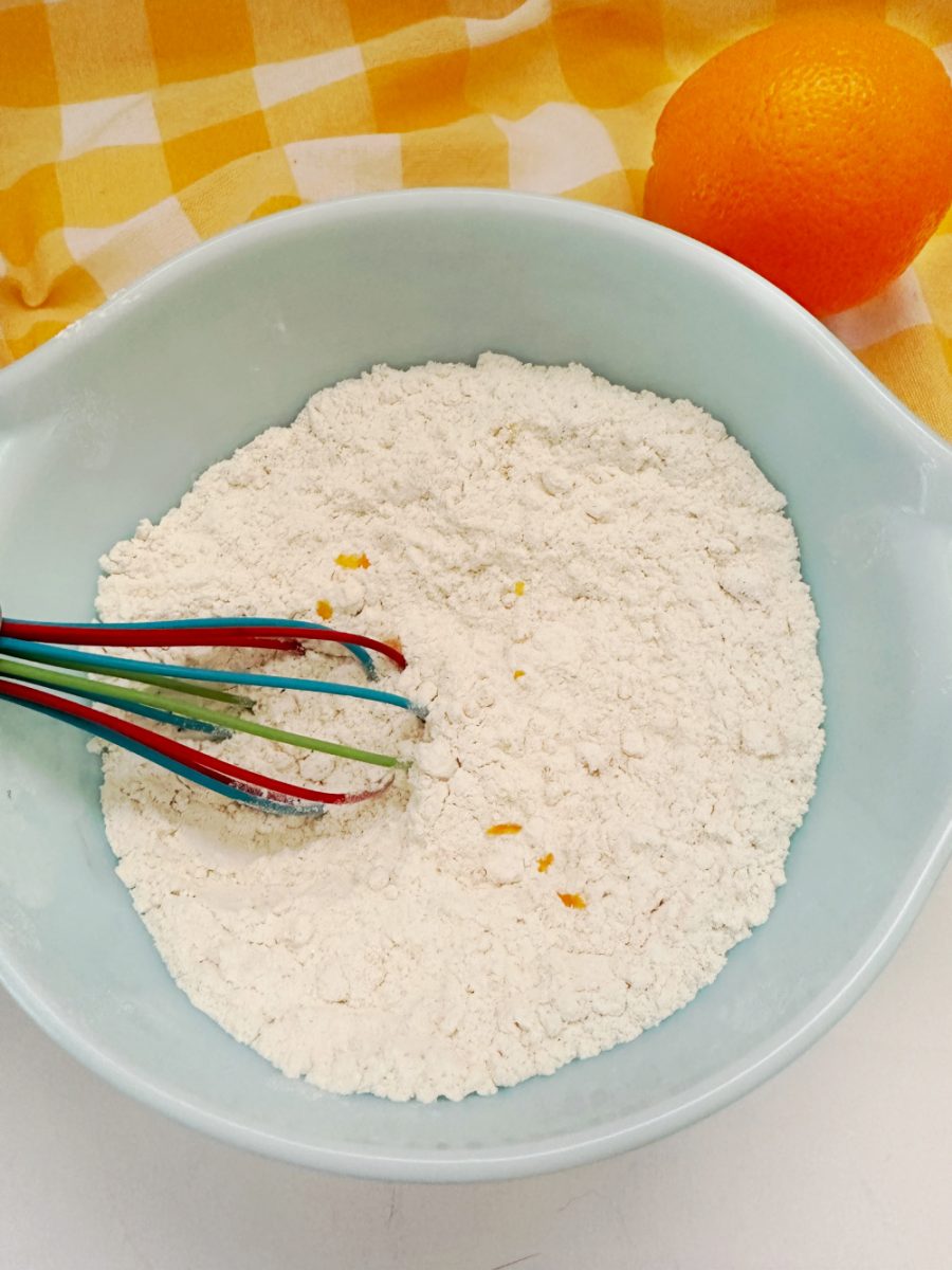 whisking the dry ingredients in white bowl