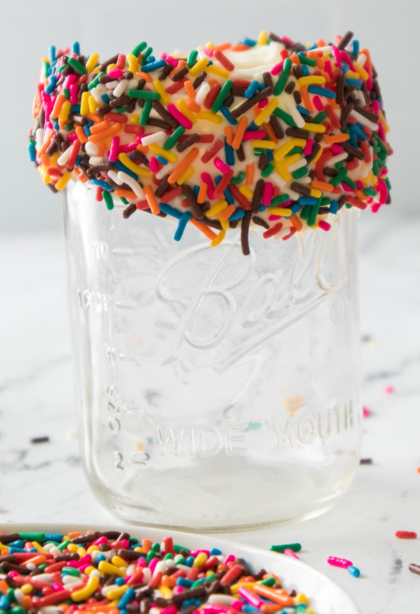 adding sprinkles to rim of milkshake glass
