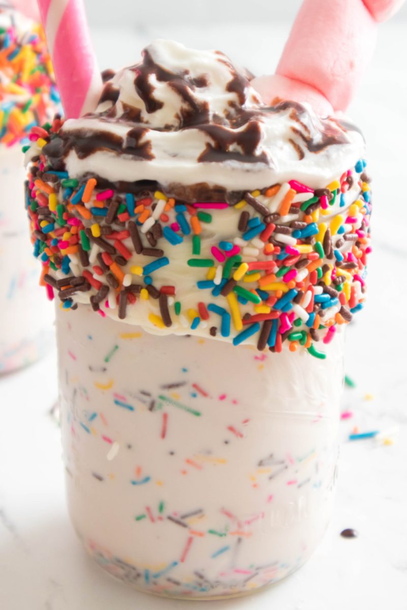 close up of easy vanilla bean milkshake with sprinkles