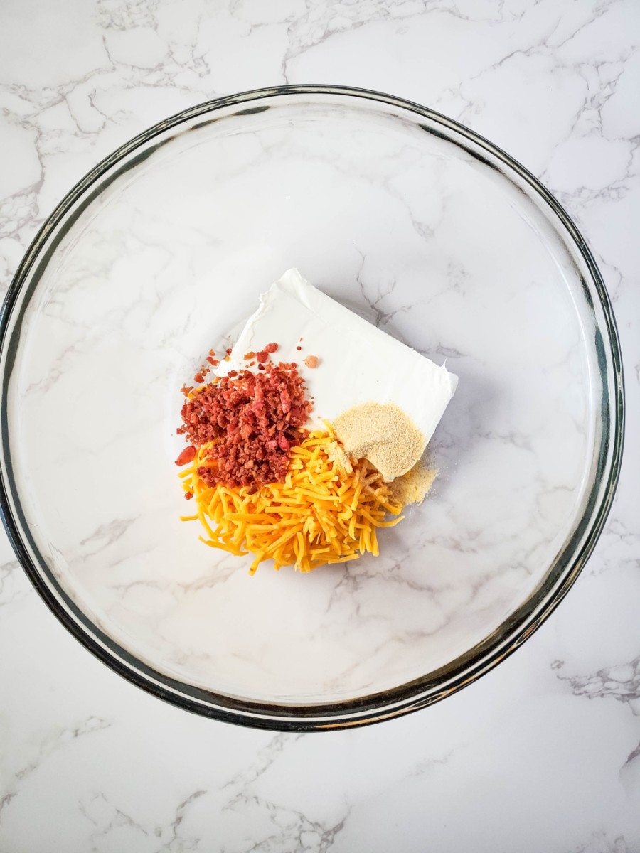 cheeses and bacon in glass bowl