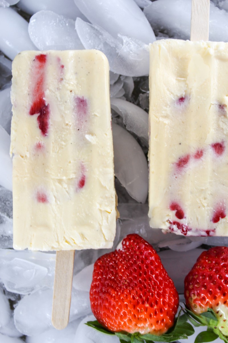 close up of creamy strawberry popsicles