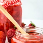 close up of homemade strawberry preserves in jars