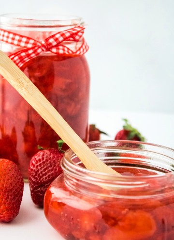 close up of homemade strawberry preserves in jars