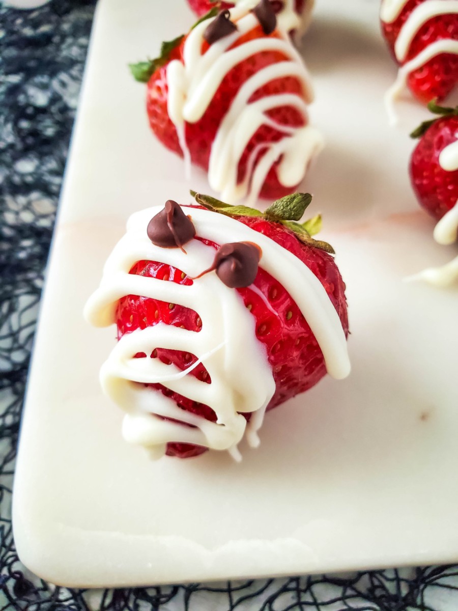 close up of strawberry mummie with eyes on plate