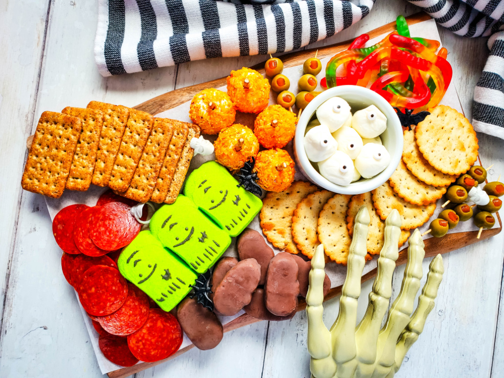 spooky charcuterie board with a variety of sweet and savory
