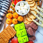 sweet and savory halloween charcuterie board with props