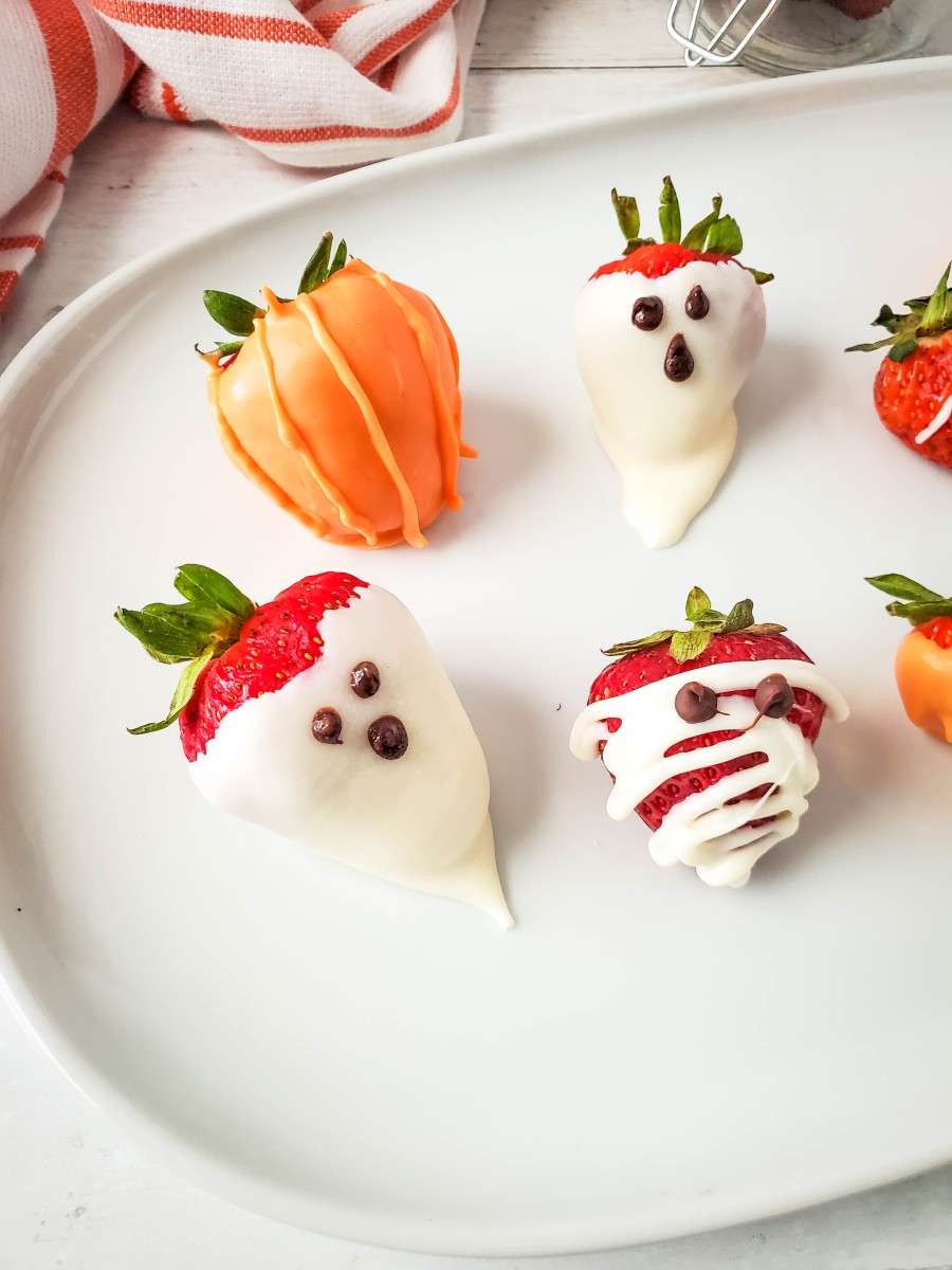 Halloween strawberries on white plate
