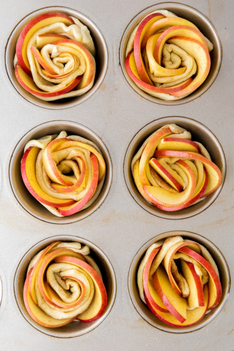 place apple roses in muffin tin