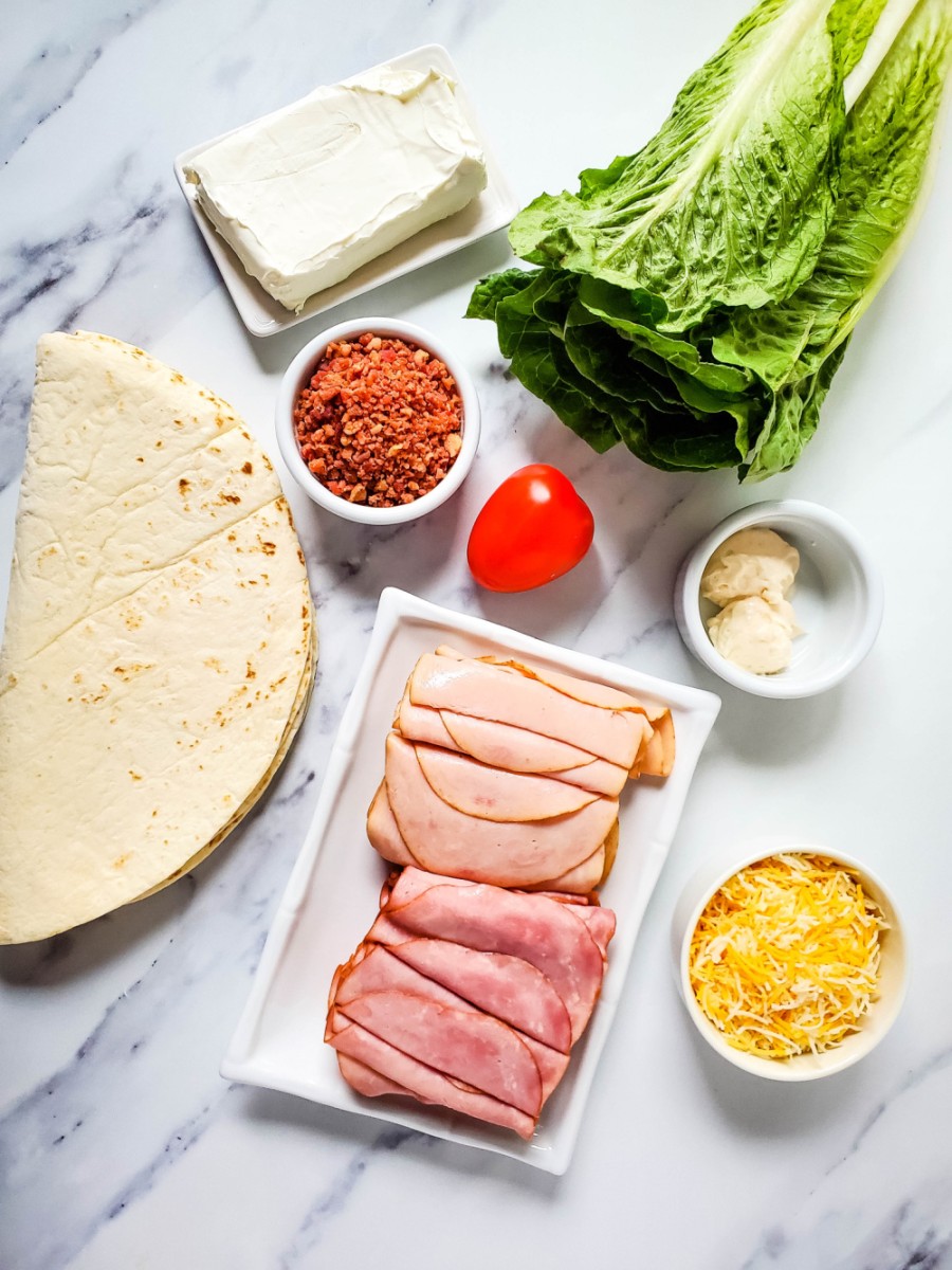 Ingredients for ham and turkey club sandwich pinwheels