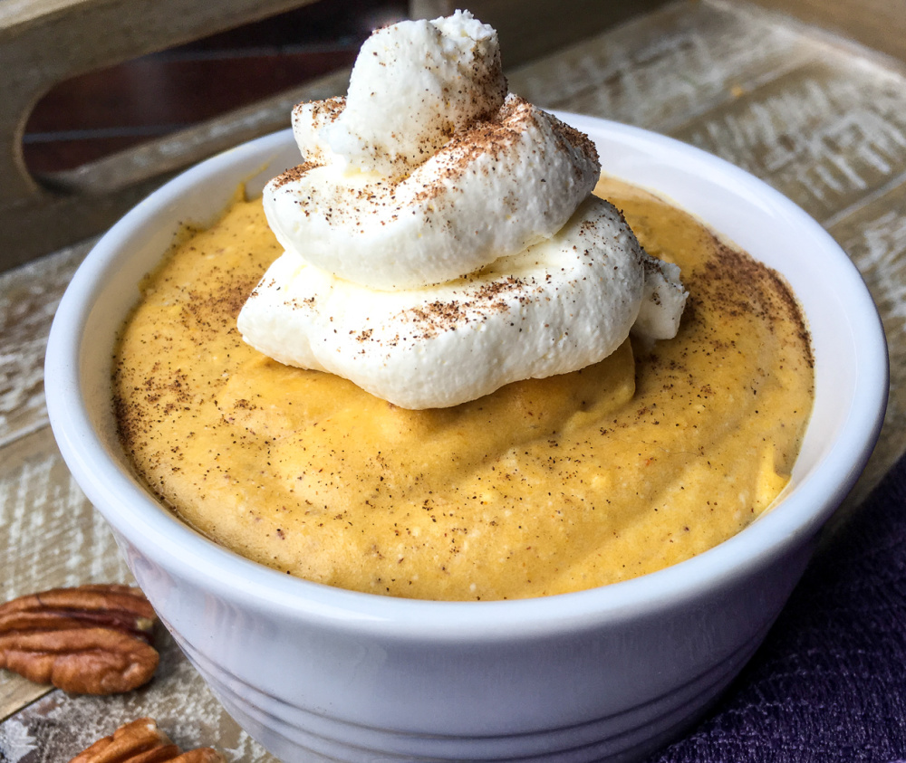 close up of pumpkin mousse in a white bowl
