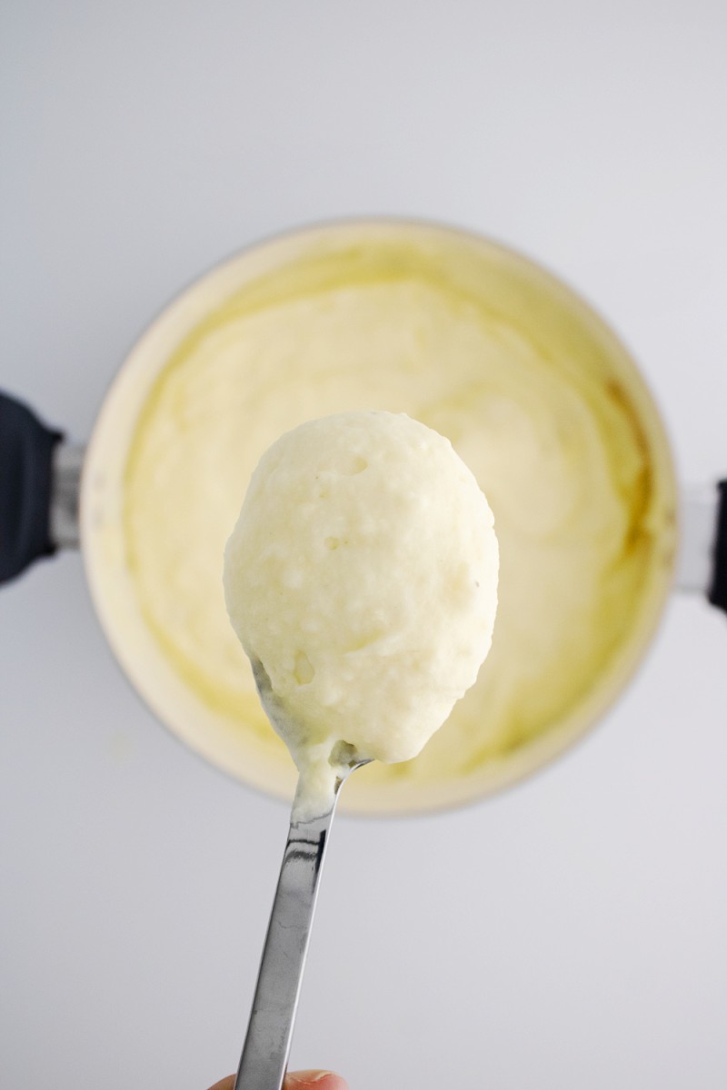 close up of spoon with creamy mashed potatoes