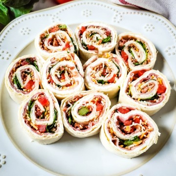 club sub sandwich pinwheels on white platter