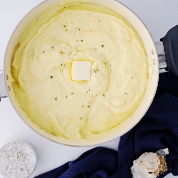 pat of butter in the creamy garlic mashed potatoes bowl