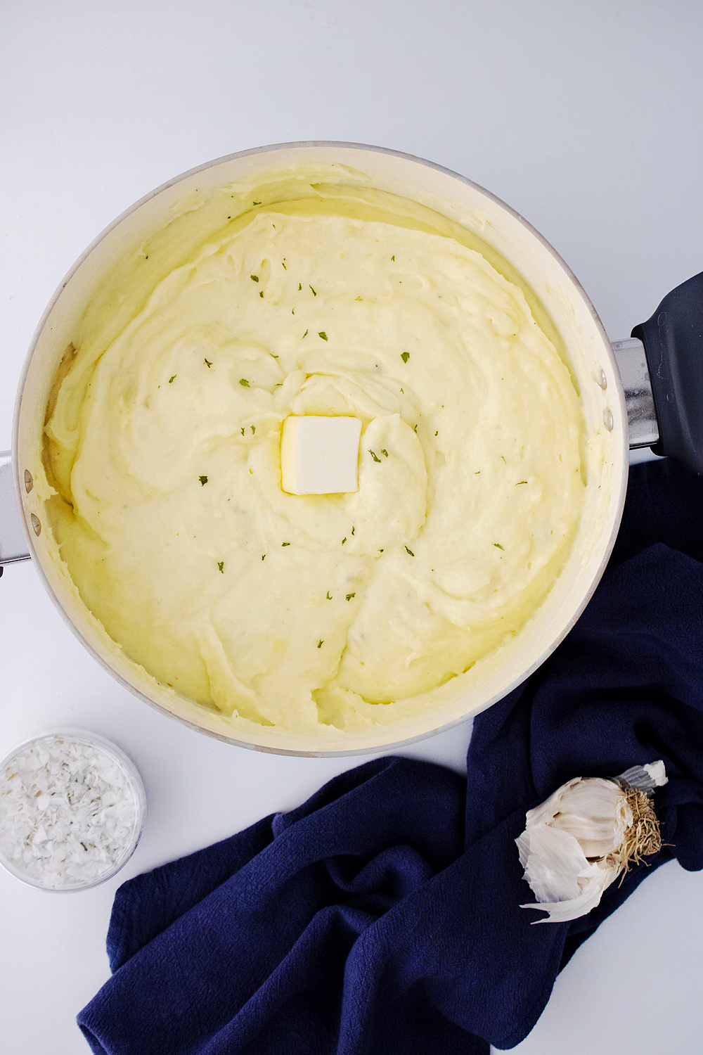pat of butter in the creamy garlic mashed potatoes bowl