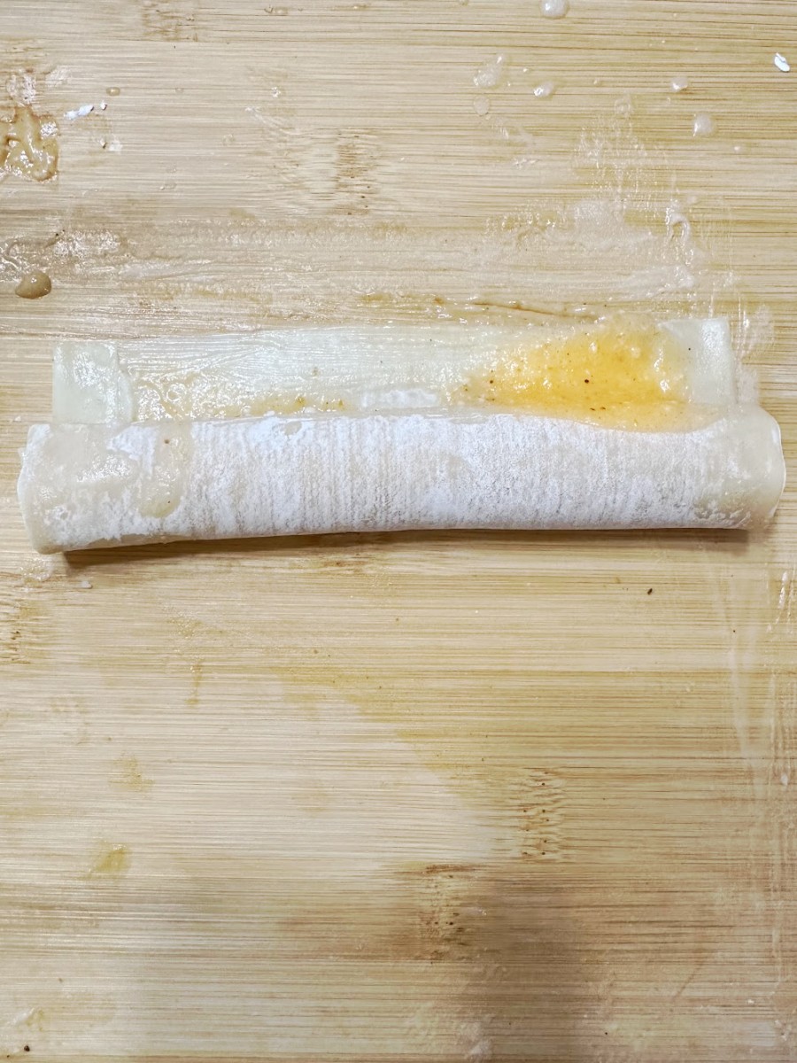roll up egg roll and seal ends - 1