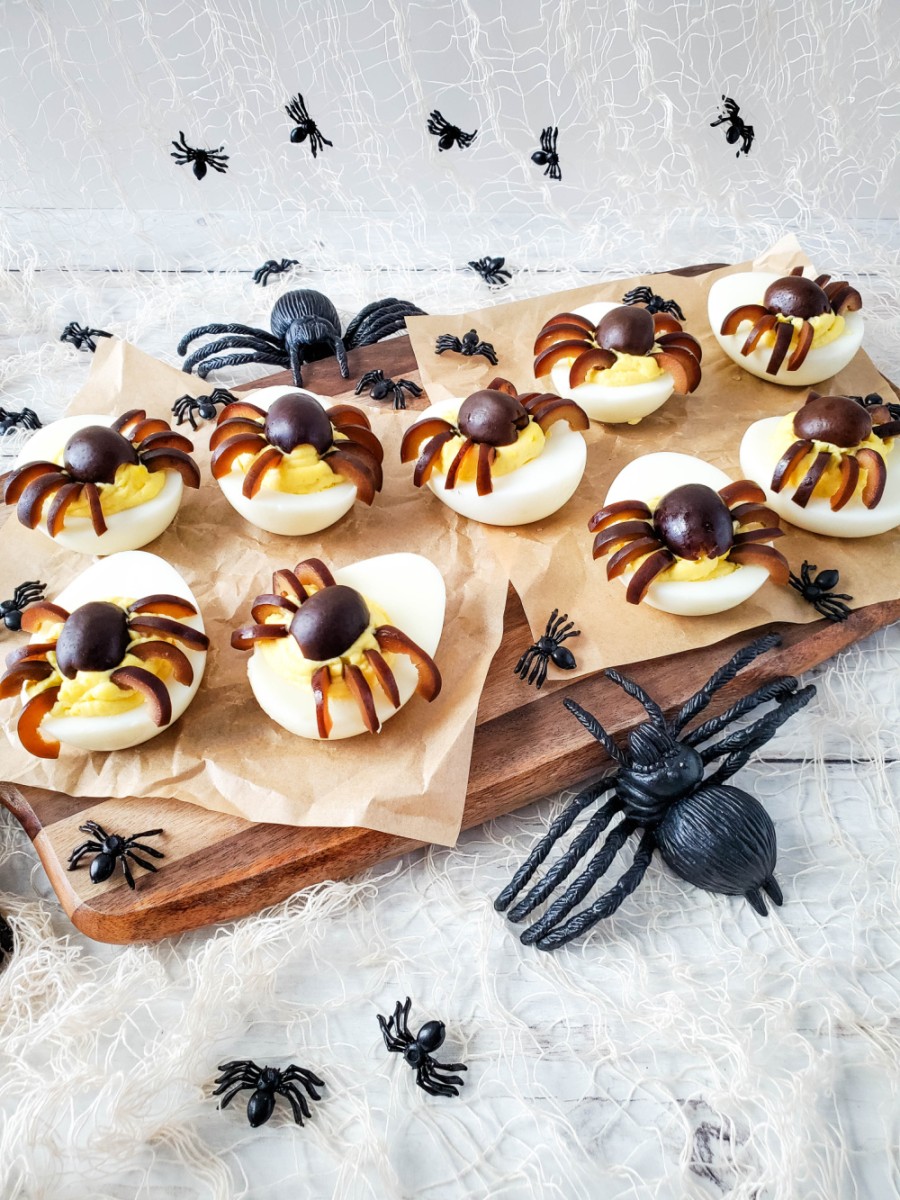 spider deviled eggs with toy spiders decor