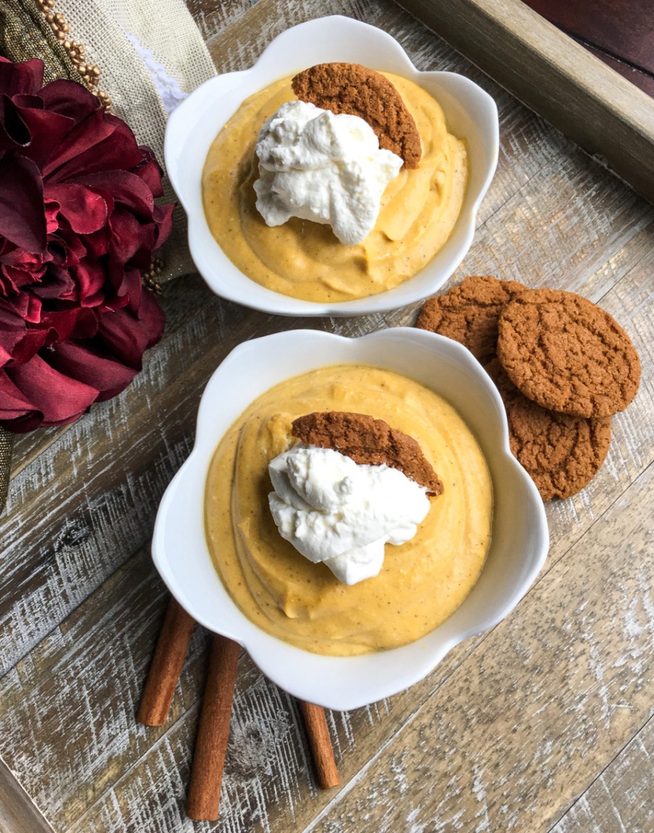 two dessert cups with pumpkin mousse dessert and gingersnaps