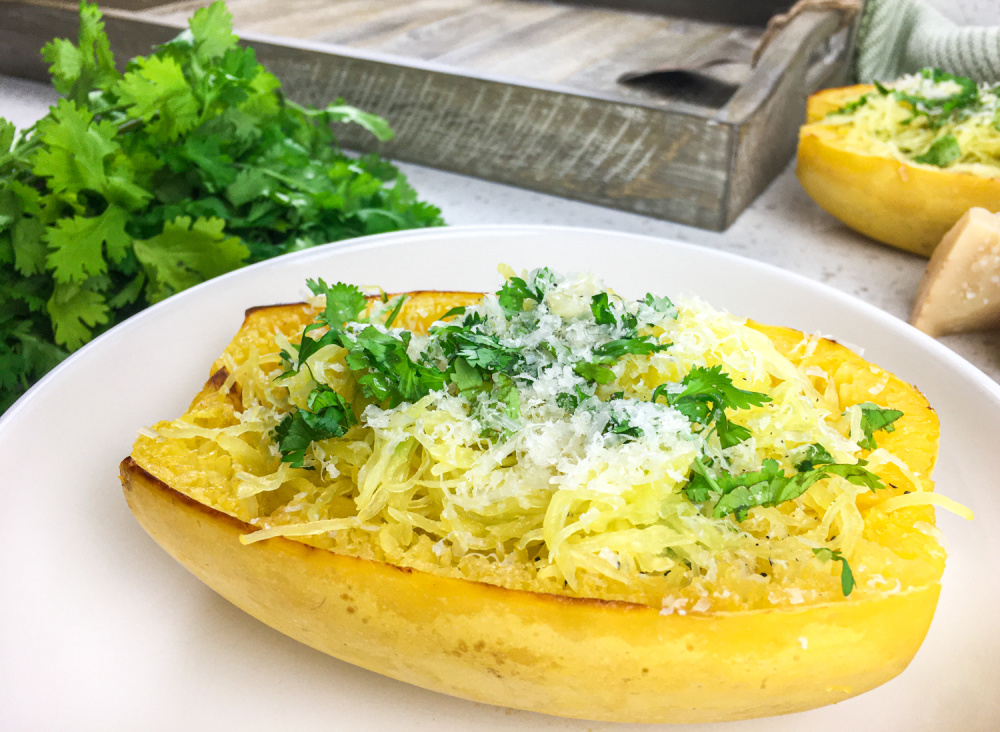 roasted spaghetti squash with cheese and topped with parsley