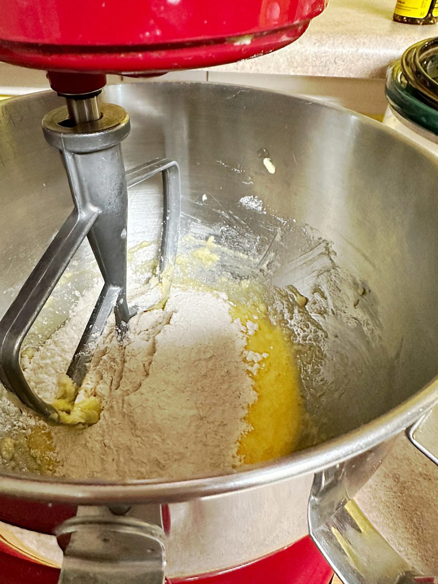 adding the flour mixture to wet ingredient for biscotti