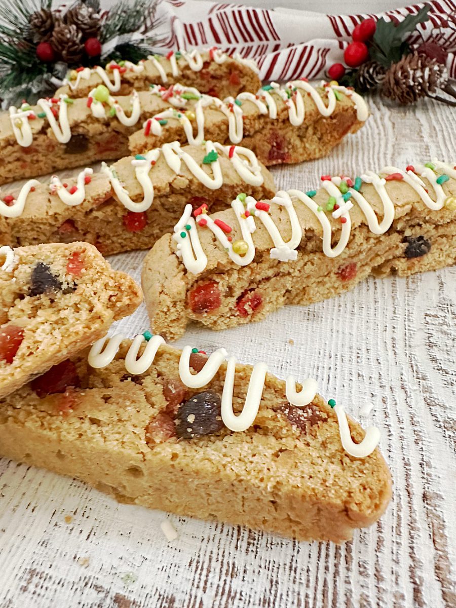 close up of Christmas Fruitcake Biscotti on wooden board
