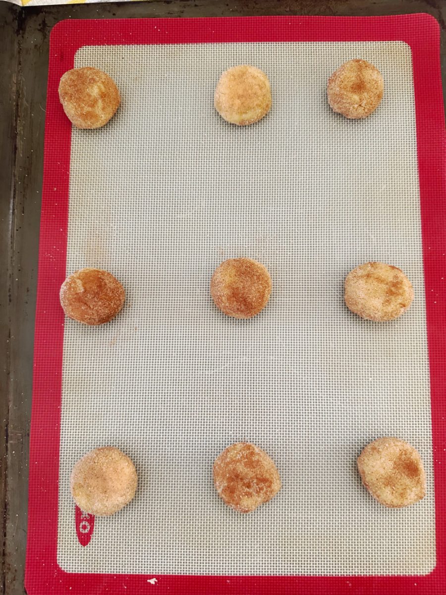 cookie dough balls on baking sheet ready to bake