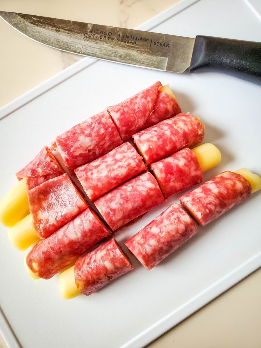mozzarella cheese stick wrapped in salami and cut into fourths