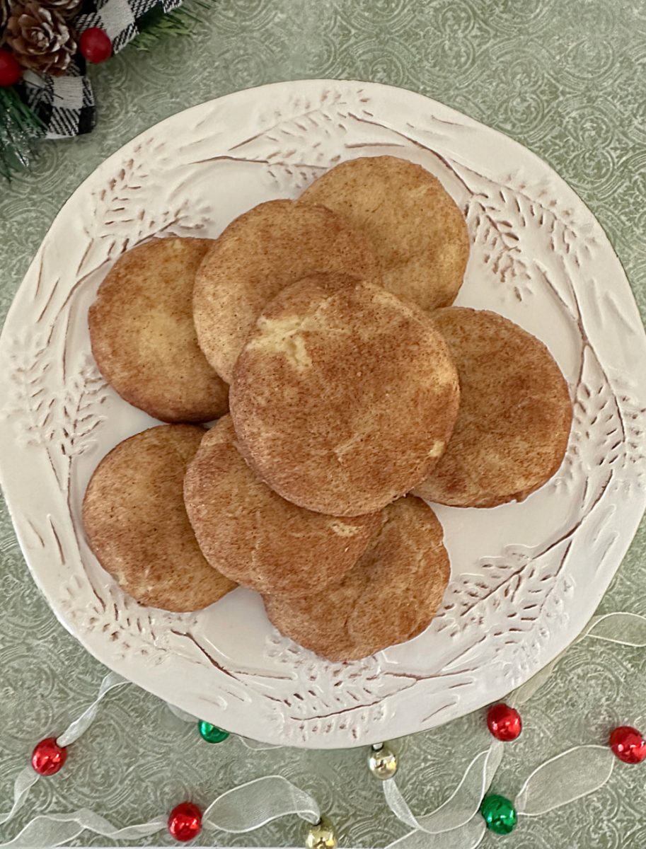 overhead view of orange cardmom snickerdoodles on christmas plate
