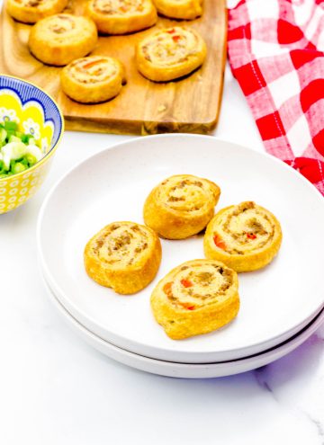 sausage cream cheese crescent rolls on white platter