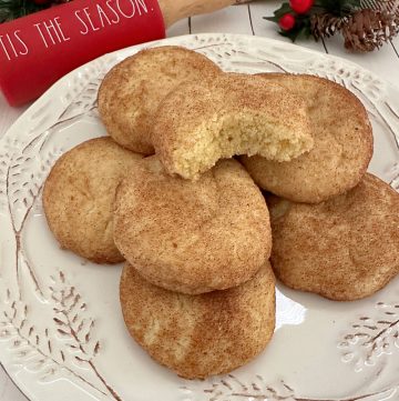 several cookies on plate with christmas decor