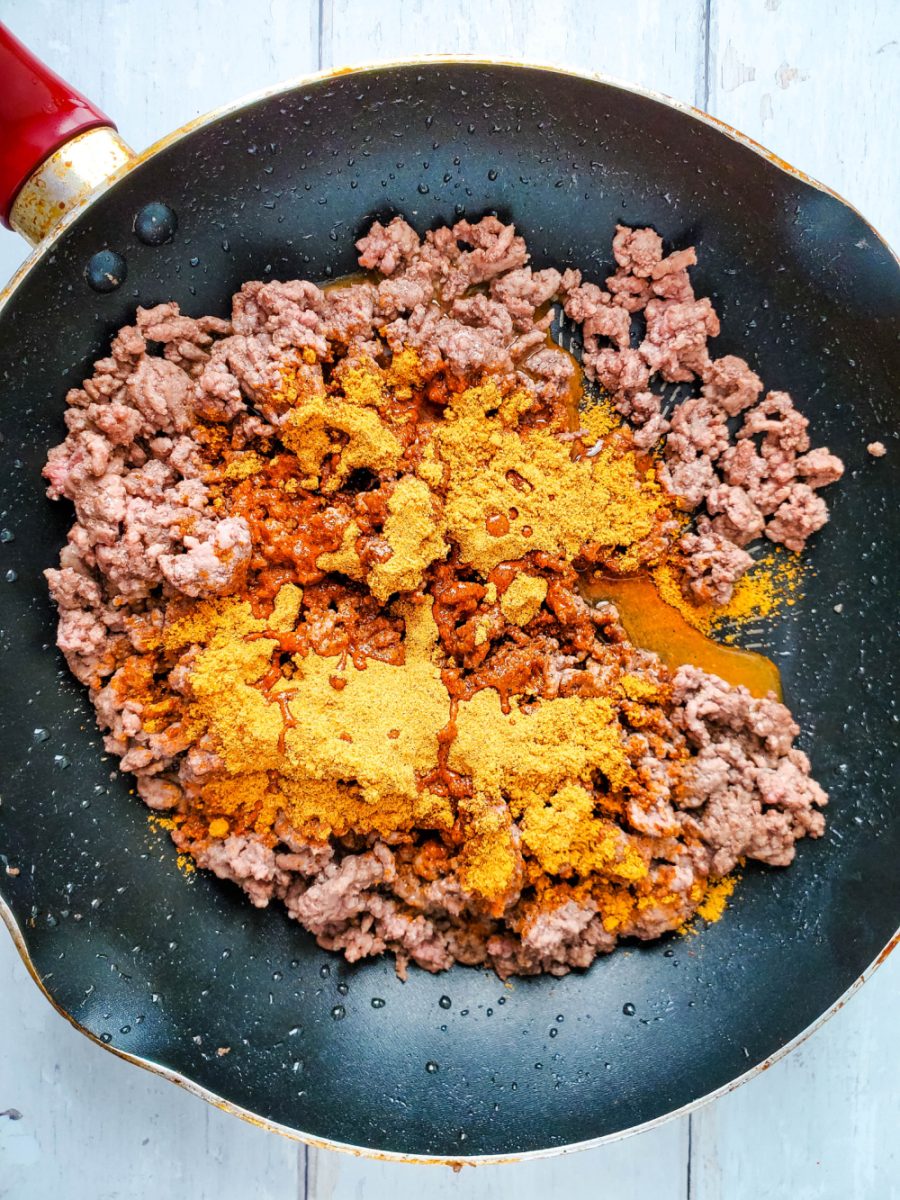 add taco seasoning and water to ground beef in skillet