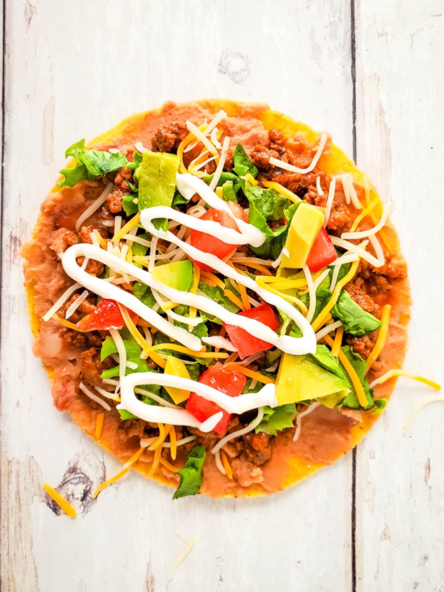 add your toppings to tostada